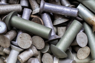 Metal hardware bolts and nails close-up. Macro photography