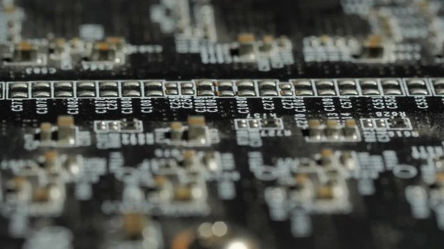 Sliding over computer motherboard. Closeup dolly macro shot. Macro shot of a chip. The circuit is used in the computer processor and the hi-tech communication , information and assistance ...