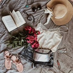 Summer flatlay with pink peonies, clothes, hat, sunglasses and asseccories - 329297618