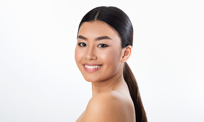 Portrait Of Asian Girl With Natural Makeup On White Background