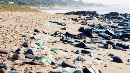 Plastic pollution litter the beach at Umkommas in Kwa Zulu South Africa