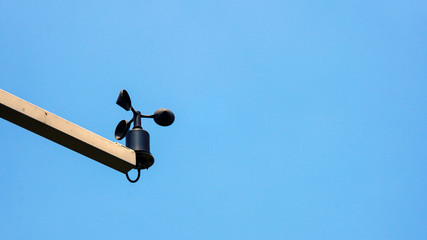  Wind energy measuring device, blue sky background.