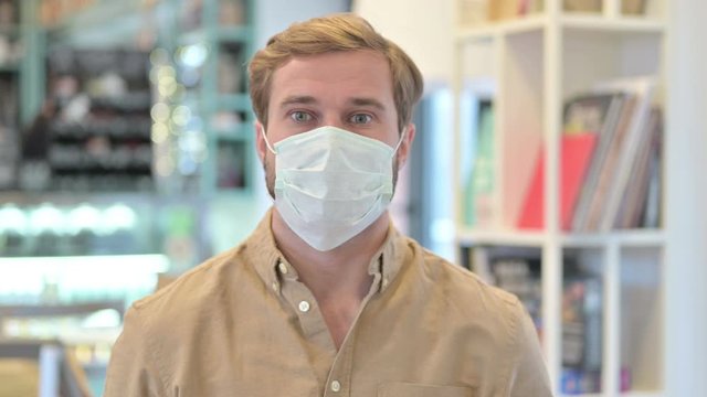 Close up of Young Man Wearing Face Mask