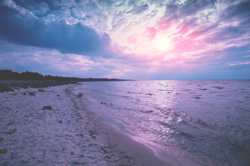 The beach in the evening with a beautiful dramatic sky. Sunset over the sea