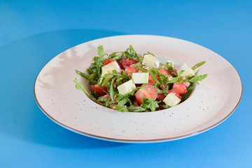 Greek salad with feta cheese, organic olives, juicy tomatoes, and lettuce. Concept for healthy nutrition.