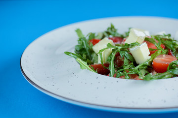 Greek salad with feta cheese, organic olives, juicy tomatoes, and lettuce. Concept for healthy nutrition.