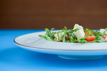 Greek salad with feta cheese, organic olives, juicy tomatoes, and lettuce. Concept for healthy nutrition.