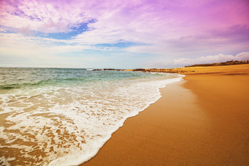Seascape in the evening. Deserted beach. Sandy seashore with beautiful sky