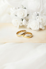 wedding rings, flowers and wedding invitation