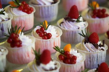 Beautiful and bright desserts on the festive table for the party.