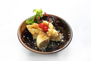 Banana fried in coconut cake. A sweet fruit dessert.