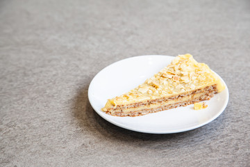 Sliced of almond tart on white plate