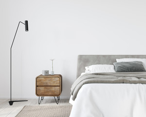 Bright bedroom with a wooden bedside table and a stylish floor lamp - obrazy, fototapety, plakaty