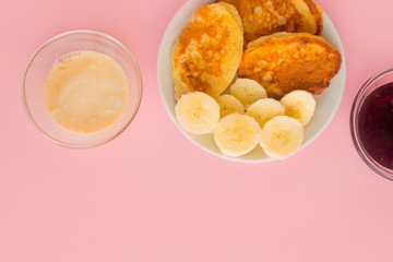 Pancakes with berries on a bright pastel background, copy space.