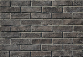 Dark grey brick wall for background and texture.  Decoration, building and renovation ideas.