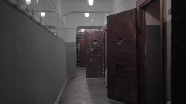 Dark prison corridor, old walls, scary