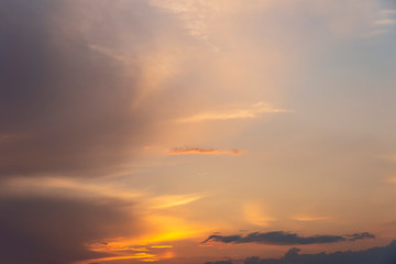 evening sky with clouds beautifully illuminated by the setting sun as a natural background