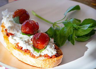 Sandwich with mozzarella cherry basil