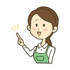 指を差すエプロンの女性　笑顔