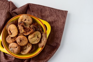 Dried figs in a yellow bowl