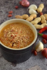 Peanut sauce or Bumbu Kacang, made from ground roasted or fried peanuts with chili, garlic, soy sauce, tamarind and spices