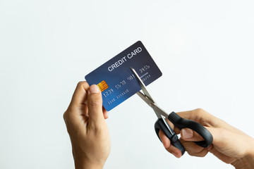 Female hands cutting credit card with scissors, copy space, top view