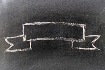 White chalk hand drawing in blank award ribbon shape on blackboard background