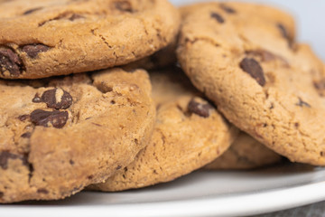 Plate of freshly baked homemade chocolate cookies close-up views