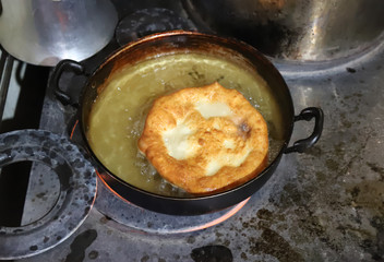 deep-fried dough fried in frying pan.artvin/turkey