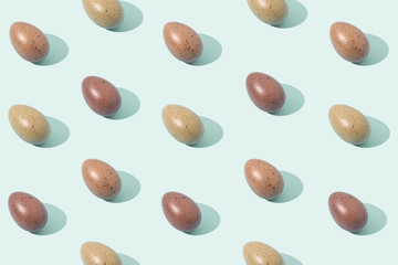 Eggs on green background. Trendy Easter pattern.