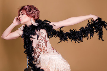 Beautiful retro woman from the roaring 20s on beige background