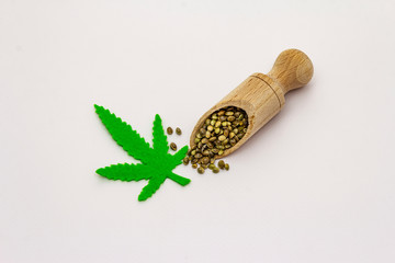 Ripe hemp seeds isolated on white background
