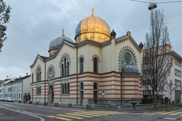 Basel, Switzerland. Great Synagogue in the morning with dome illuminated by the rising sun. The synagogue was built in 1868 and expanded in 1892.