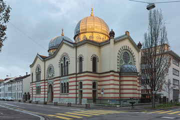 Basel, Switzerland. Great Synagogue in the morning with dome illuminated by the rising sun. The...