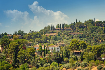 Fototapeta na wymiar Mediterranean villas on a hills, spanish province. Toledo, Spain