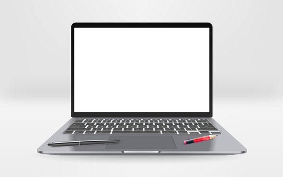 Modern laptop with empty screen with pen and pencil