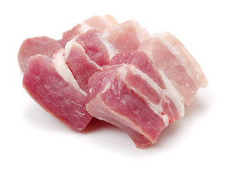 Raw pork belly pieces on a white background