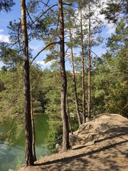 quarry with a lake in the forest
