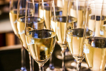Glasses of champagne and sparkling wine served at charity event, alcoholic drinks © Studio ANNA