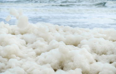 Close-up abstract of a lot of sea foam on the shore. Ecology. - 329318813