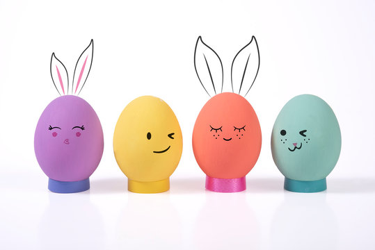 Easter holiday creative with handmade eggs colored. Group cute bunny a Various emotions..