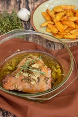 Roasted chicken thighs with olive oil, garlic and rosemary. Served with baked potato wedges