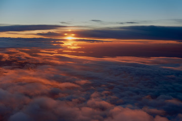 Fototapeta premium Sea of clouds in the morning surise from an airplane