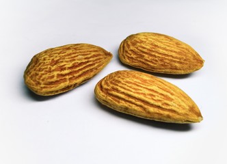 Three almond with white background stock photo