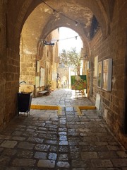 Tel Aviv, Israel - July 2018. Part of Tel Aviv - Jaffa, Old City. Old stone street, arc in the artistic neighbourhood with many galleries