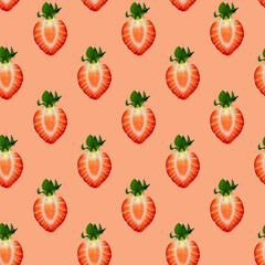 Seamless pattern of the halves of the red strawberries on a pink background