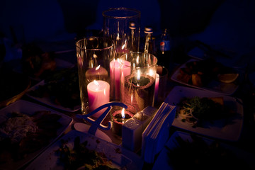 burning candles with yellow bokeh