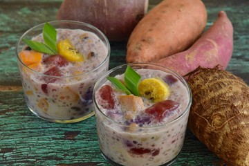 Bubur Cha Cha, Malay dessert made from tapioca pearls, sweet potato, taro, yam, banana, black eyed...