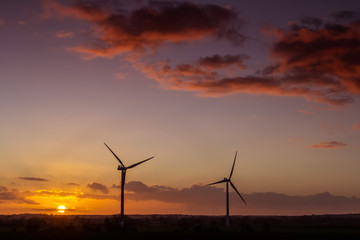 wind turbines at sunset
