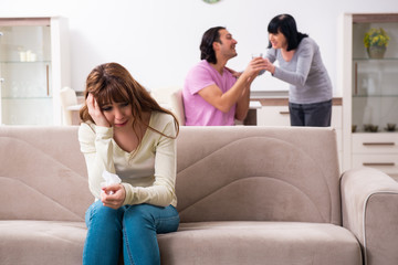 Young family and mother-in-law in family issues concept